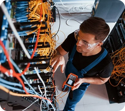 IT technician fixing phone system